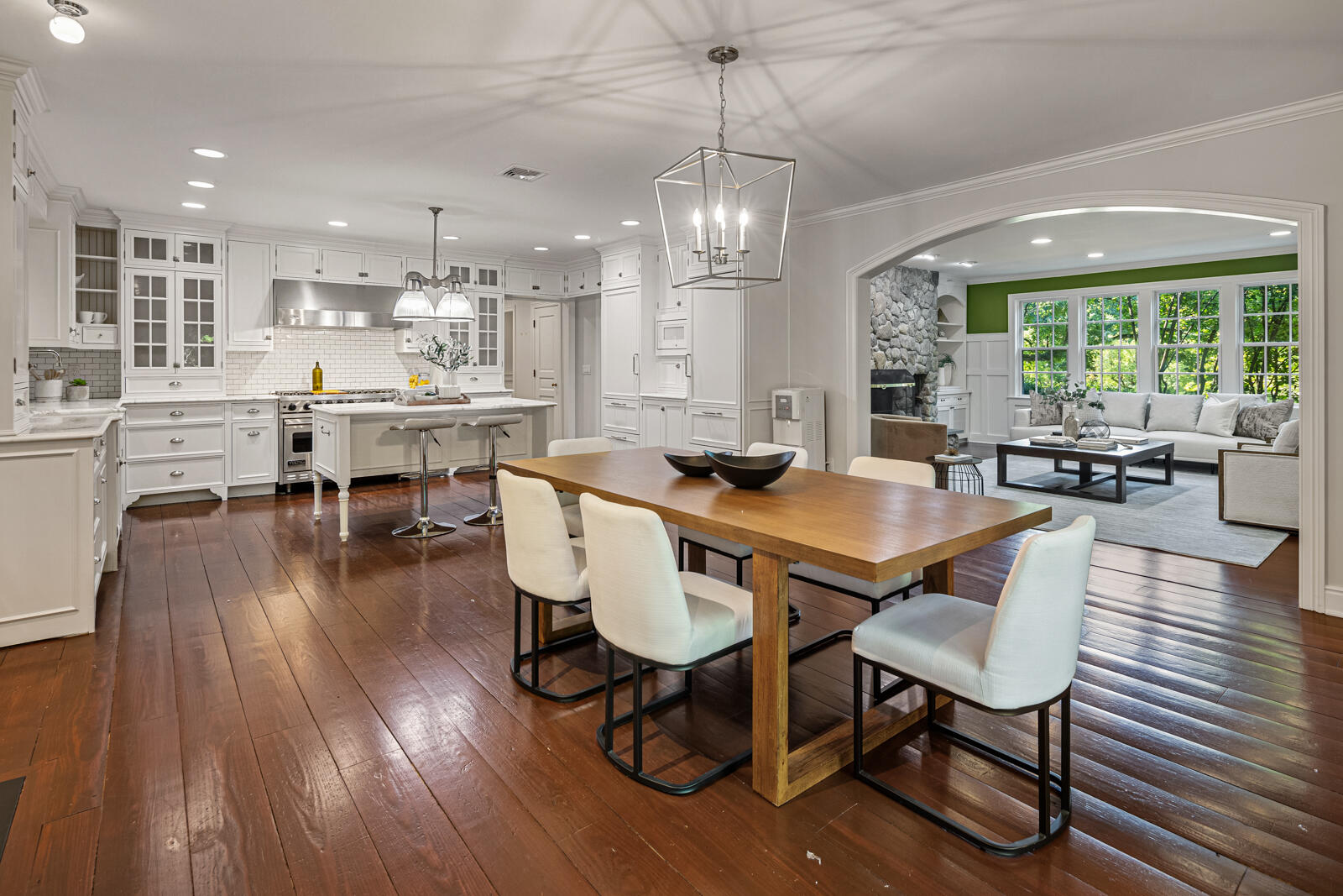 1446 Ponus Ridge Road New Canaan, CT 06840 - Photo 5 of 25 a view of a dining room with furniture window and wooden floor