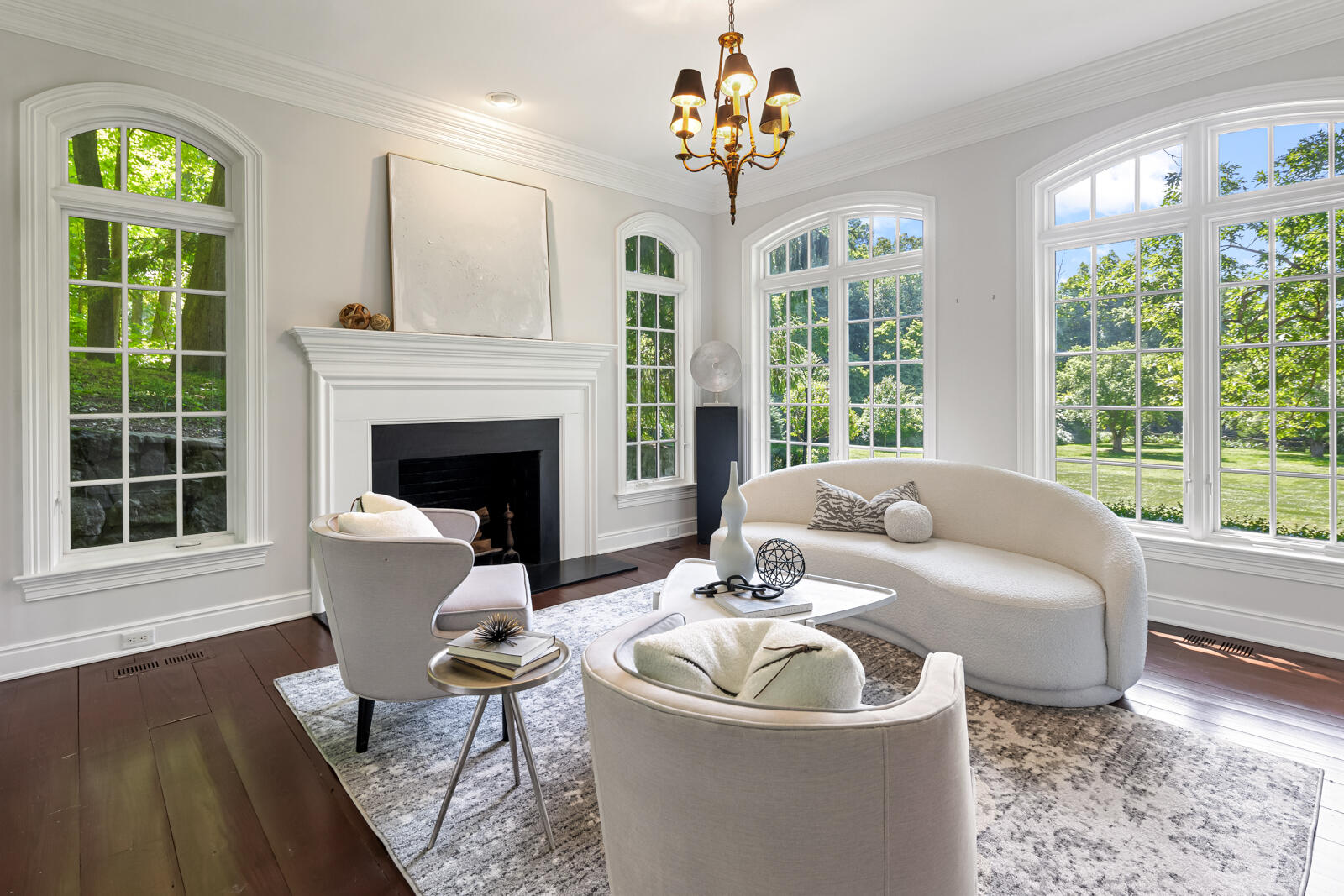 1446 Ponus Ridge Road New Canaan, CT 06840 - Photo 9 of 25 a living room with furniture a fireplace and a large window