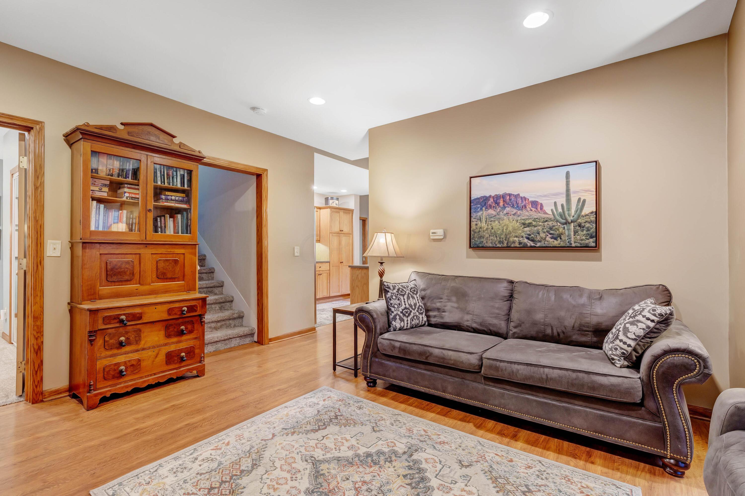6681 Harlem Road Westerville, OH 43082 - Photo 5 of 78 • Laminate flooring • Tan painted walls • Can lighting • Bay wall