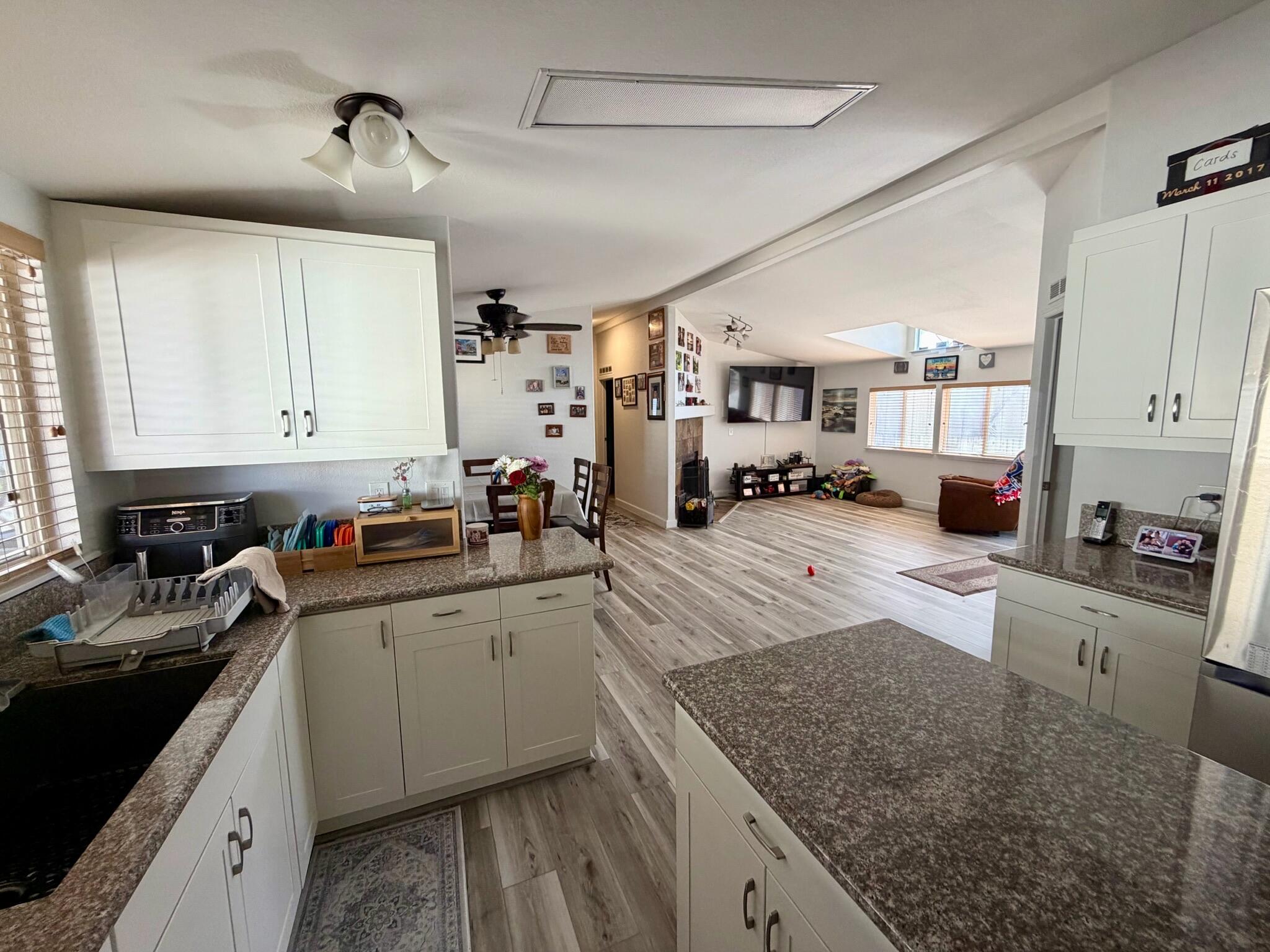 9080 Bloomfield Street, Unit 270 Cypress, CA 90630 - Photo 11 of 34 a kitchen with stainless steel appliances granite countertop a sink stove and cabinets