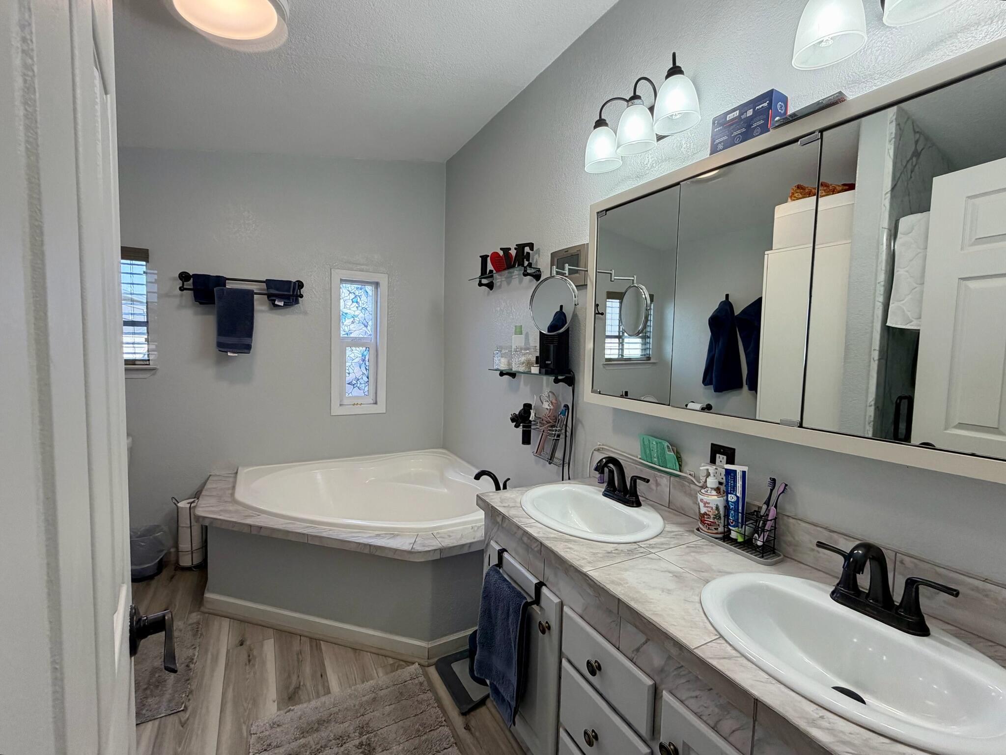 9080 Bloomfield Street, Unit 270 Cypress, CA 90630 - Photo 18 of 34 a bathroom with a sink a toilet and mirror