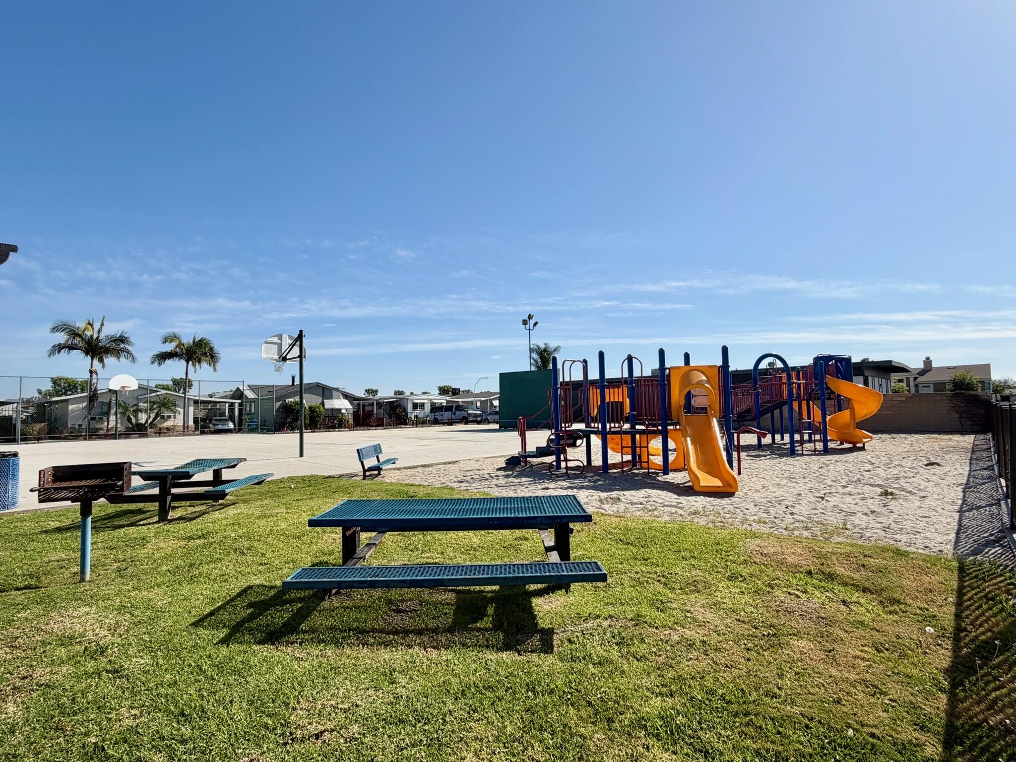 9080 Bloomfield Street, Unit 270 Cypress, CA 90630 - Photo 32 of 34 a view of a swimming pool with lounge chairs