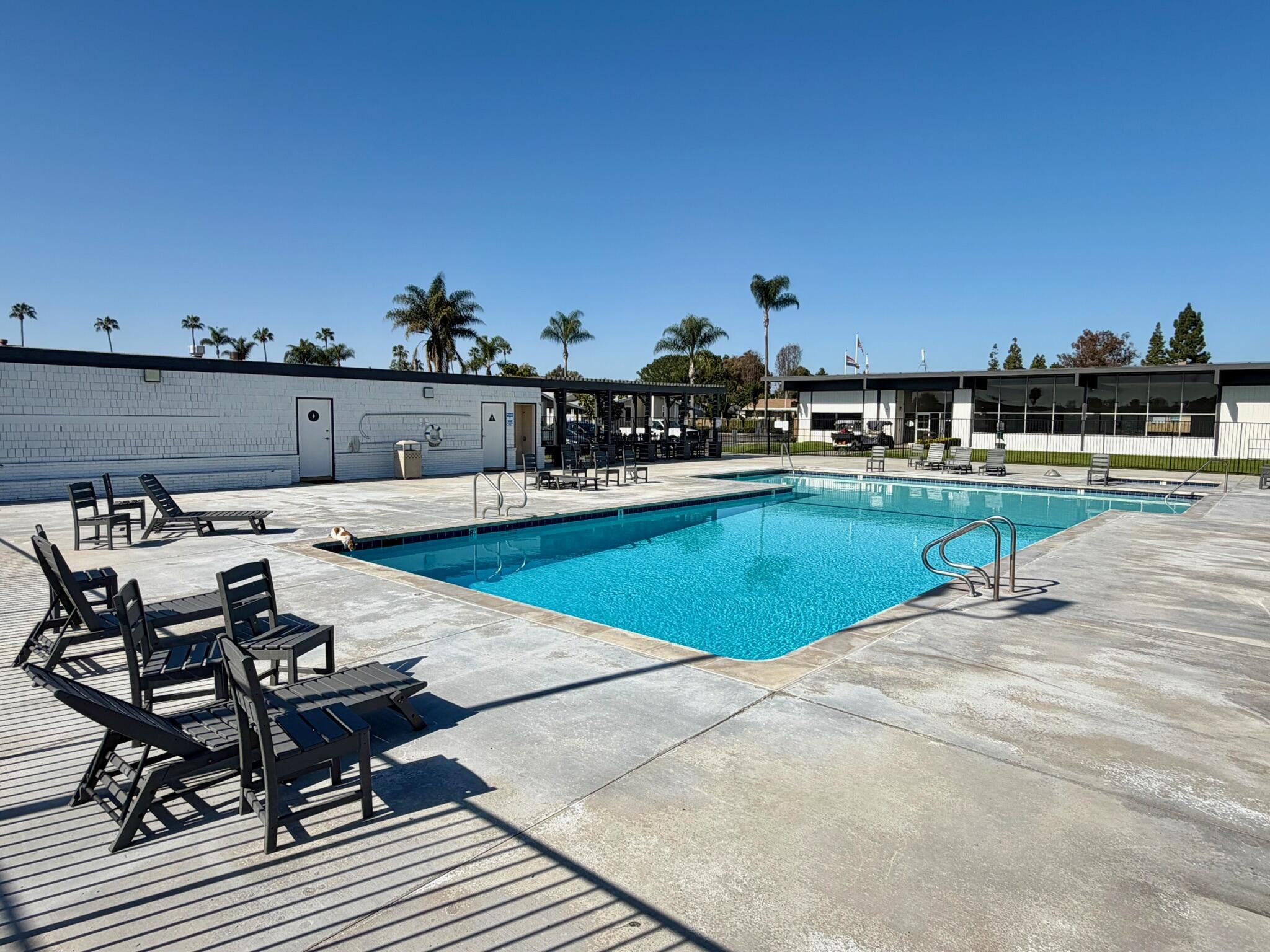 9080 Bloomfield Street, Unit 270 Cypress, CA 90630 - Photo 33 of 34 a view of a swimming pool with outdoor seating
