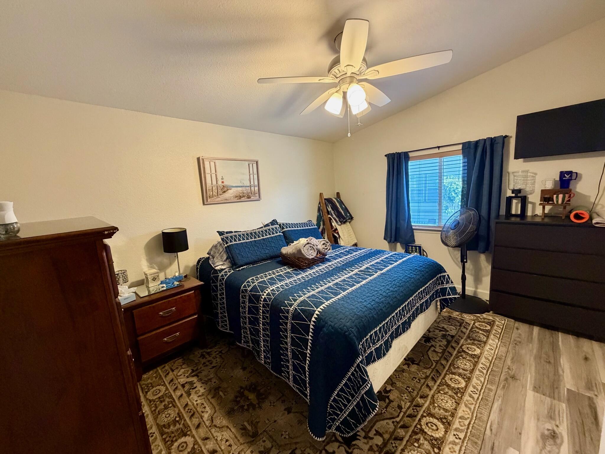 9080 Bloomfield Street, Unit 270 Cypress, CA 90630 - Photo 5 of 34 a bedroom with bed and wooden floor