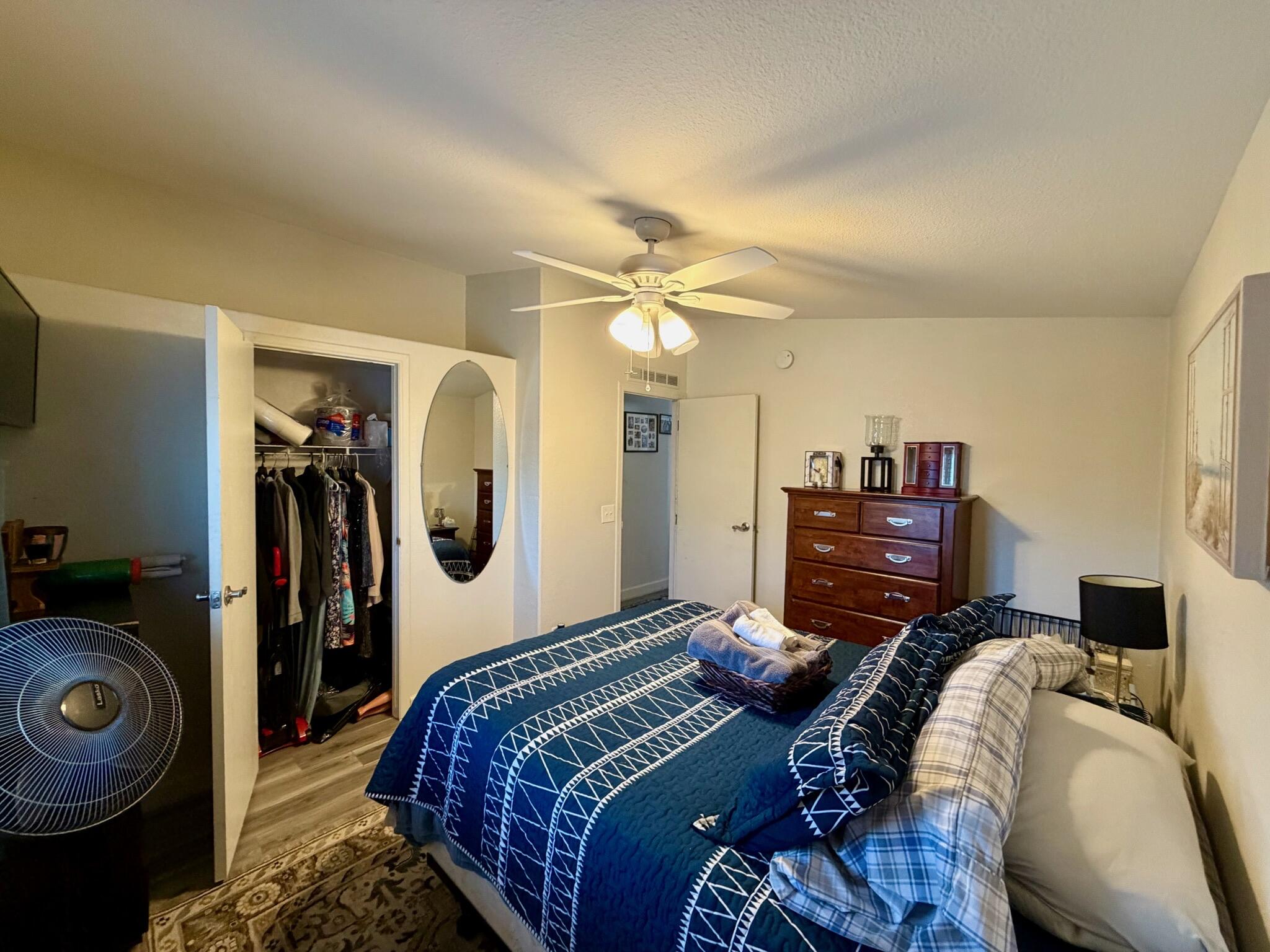 9080 Bloomfield Street, Unit 270 Cypress, CA 90630 - Photo 6 of 34 a bedroom with a bed and a chandelier