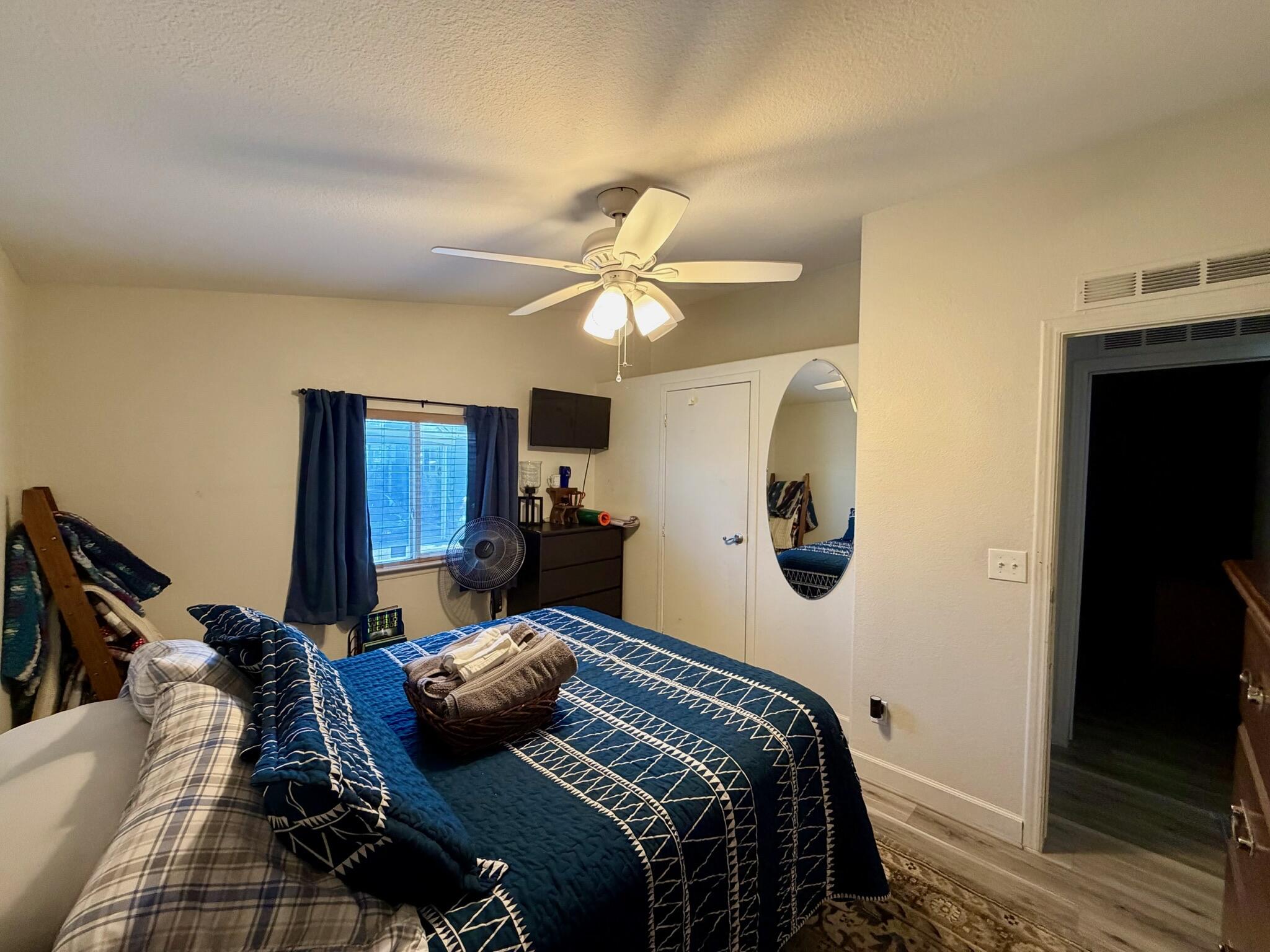 9080 Bloomfield Street, Unit 270 Cypress, CA 90630 - Photo 7 of 34 a bedroom with bed and a chandelier