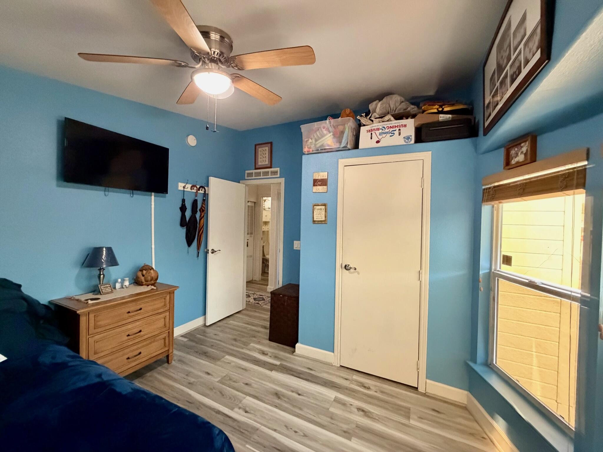 9080 Bloomfield Street, Unit 270 Cypress, CA 90630 - Photo 9 of 34 a room with furniture and a flat screen tv