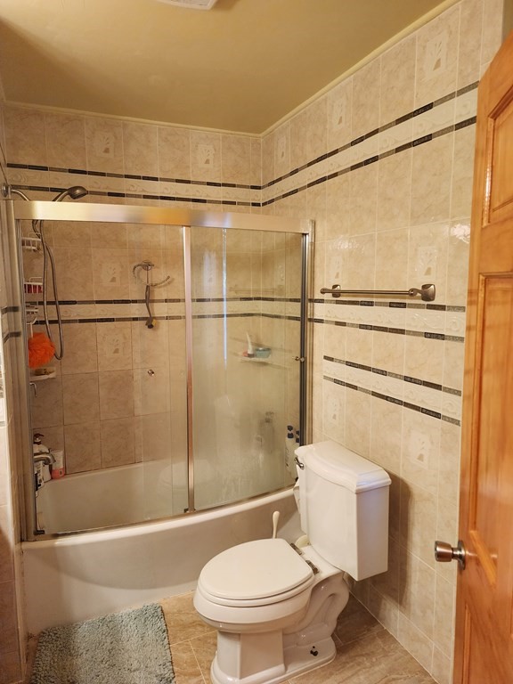 2 Thayer Street Worcester, MA 01603 - Photo 17 of 33 a bathroom with a toilet and a shower