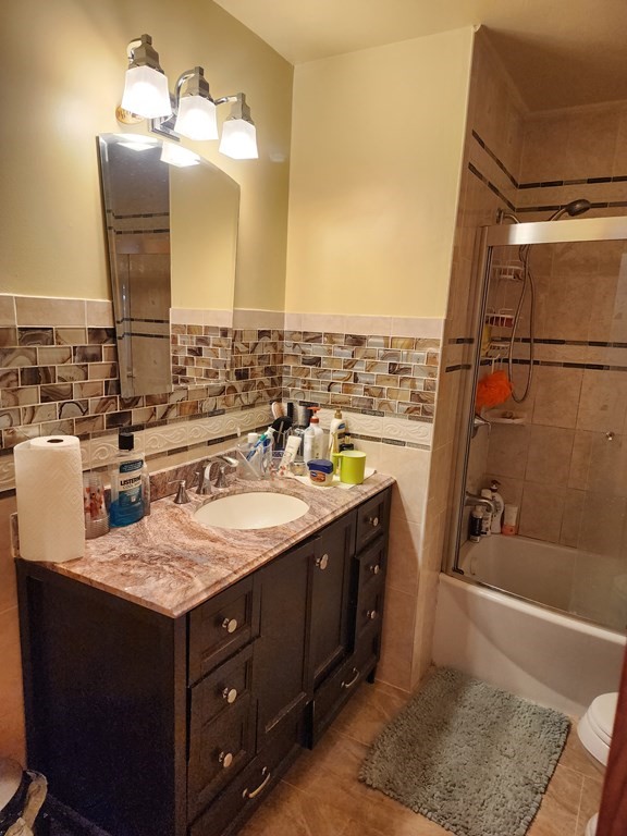 2 Thayer Street Worcester, MA 01603 - Photo 18 of 33 a bathroom with a sink vanity granite tub and shower