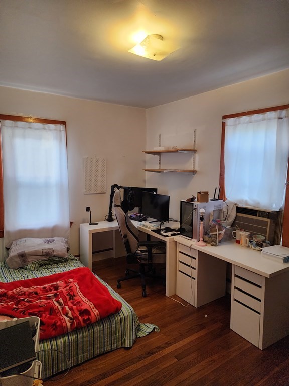 2 Thayer Street Worcester, MA 01603 - Photo 22 of 33 a bedroom with furniture and a wooden floor