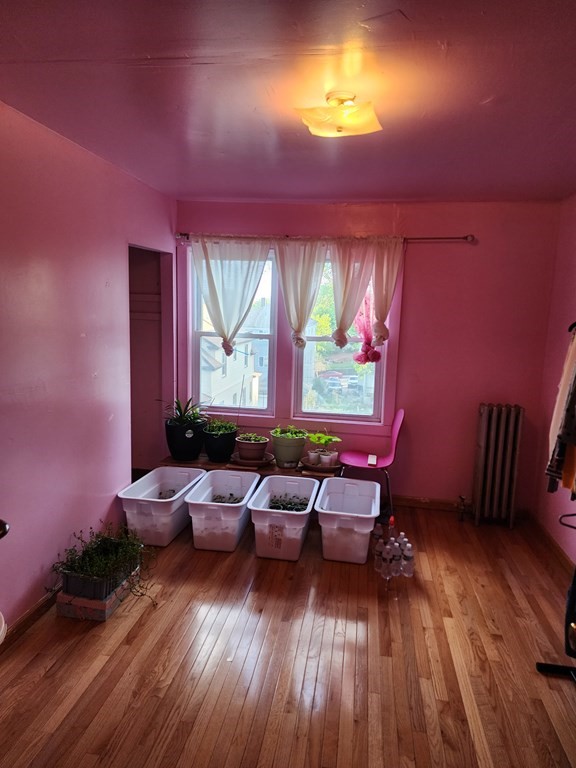 2 Thayer Street Worcester, MA 01603 - Photo 24 of 33 a living room with furniture and wooden floor