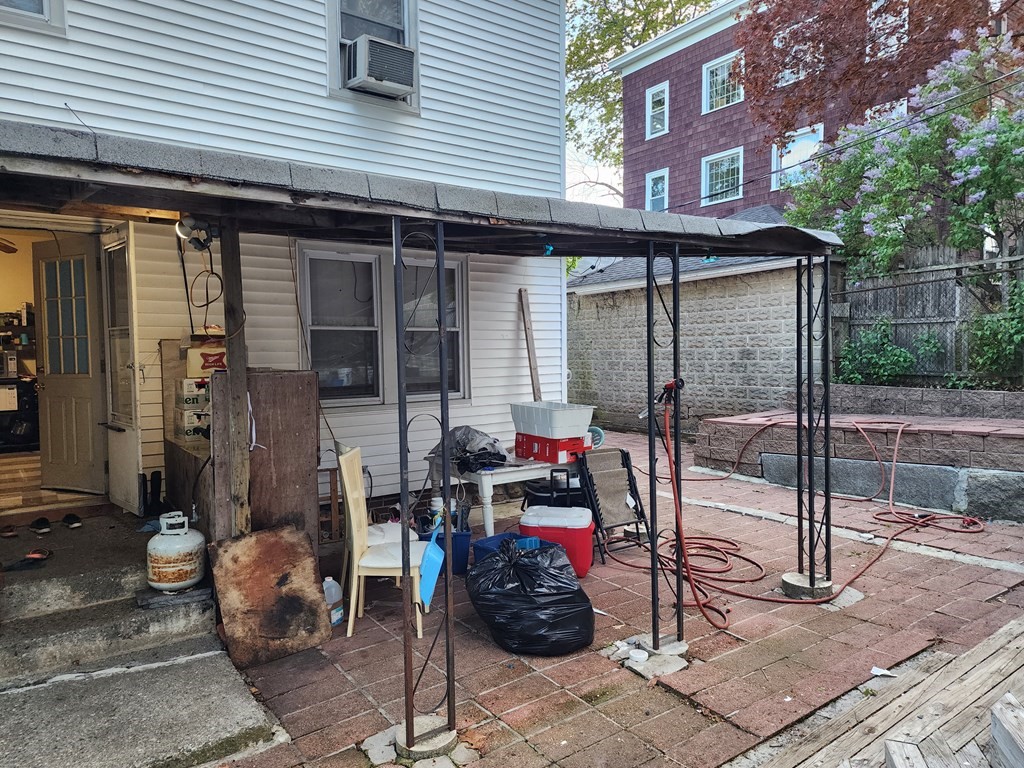 2 Thayer Street Worcester, MA 01603 - Photo 29 of 33 a view of a brick house with a potted plant and a table and chair
