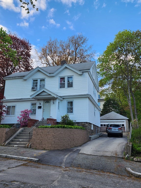 2 Thayer Street Worcester, MA 01603 - Photo 3 of 33 a front view of a house with a yard