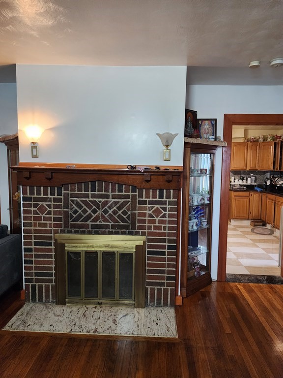 2 Thayer Street Worcester, MA 01603 - Photo 6 of 33 a kitchen with stainless steel appliances a stove and a refrigerator