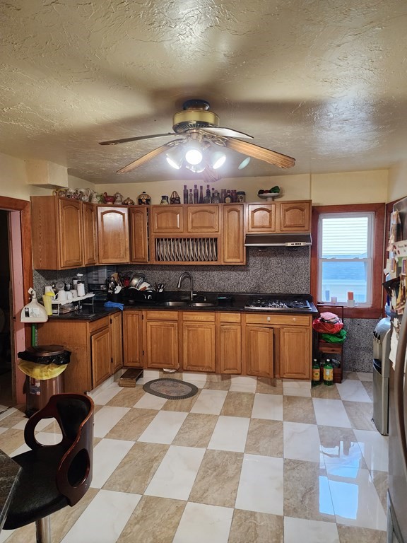 2 Thayer Street Worcester, MA 01603 - Photo 10 of 33 a kitchen with a sink and cabinets