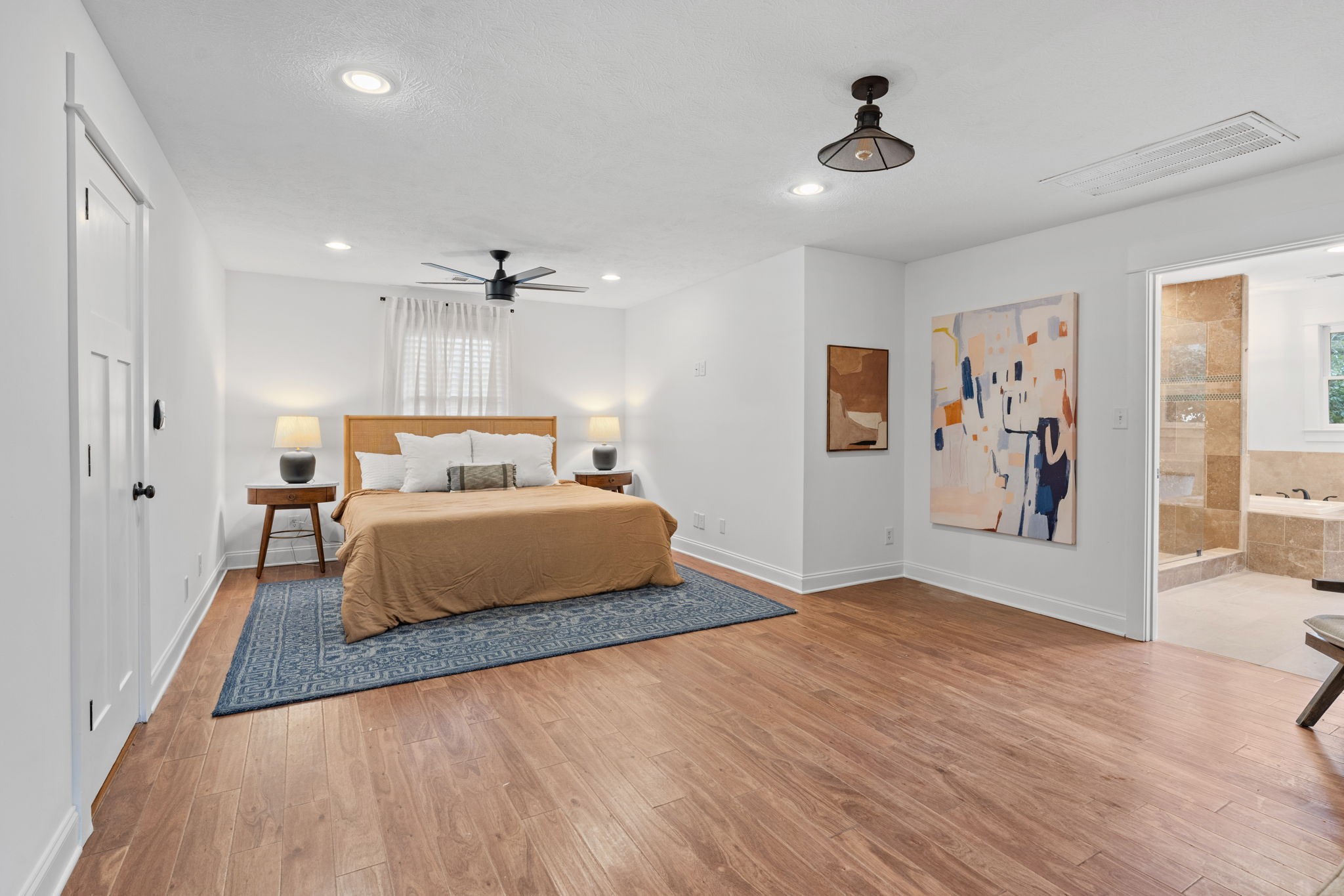 4462 Harpeth School Road Franklin, TN 37064 - Photo 23 of 45 a bedroom with a large bed and a chandelier