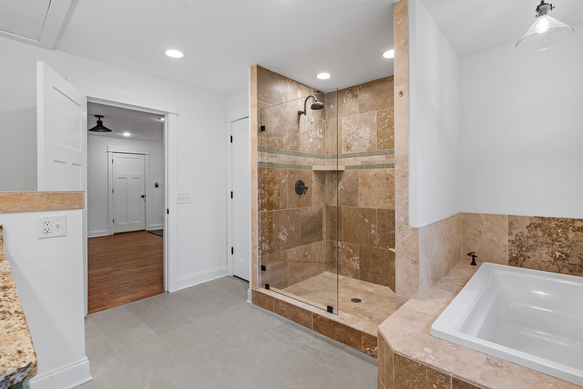 4462 Harpeth School Road Franklin, TN 37064 - Photo 26 of 45 a bathroom with a tub shower and mirror