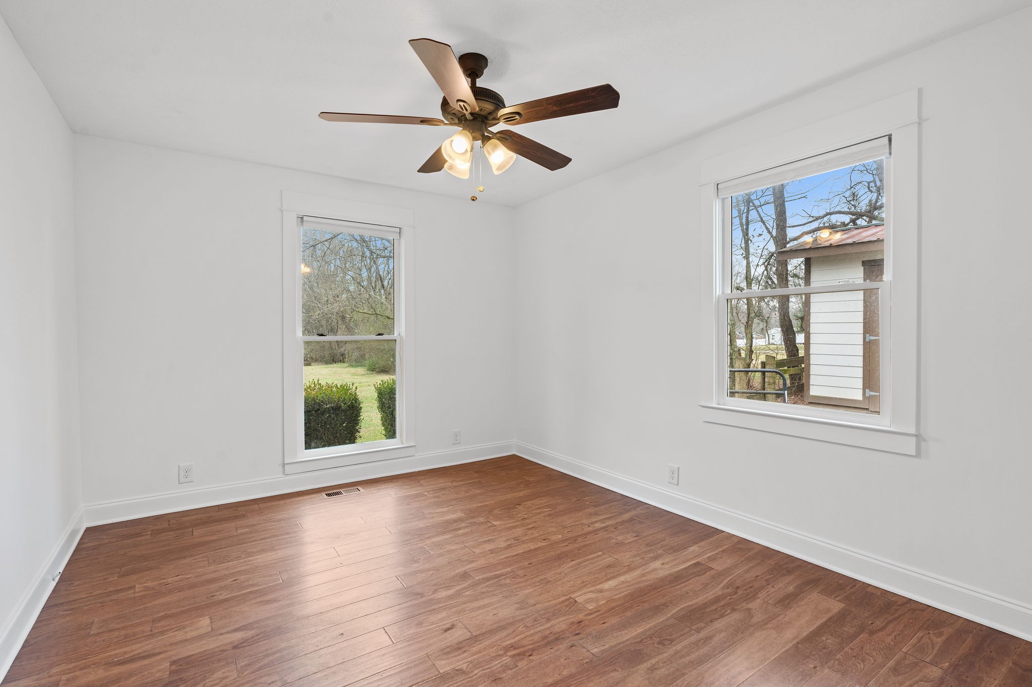 4462 Harpeth School Road Franklin, TN 37064 - Photo 32 of 45 a view of an empty room with wooden floor and a window