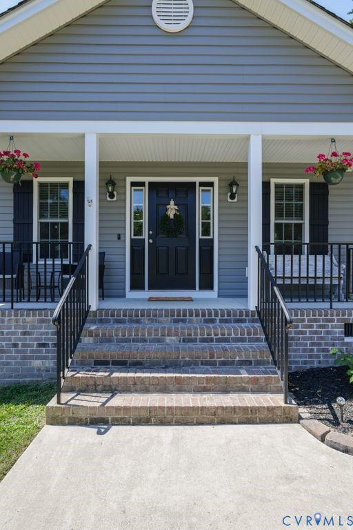 222 Oak Ridge Court Aylett, VA 23009 - Photo 4 of 35 Inviting covered porch with brick steps, black met