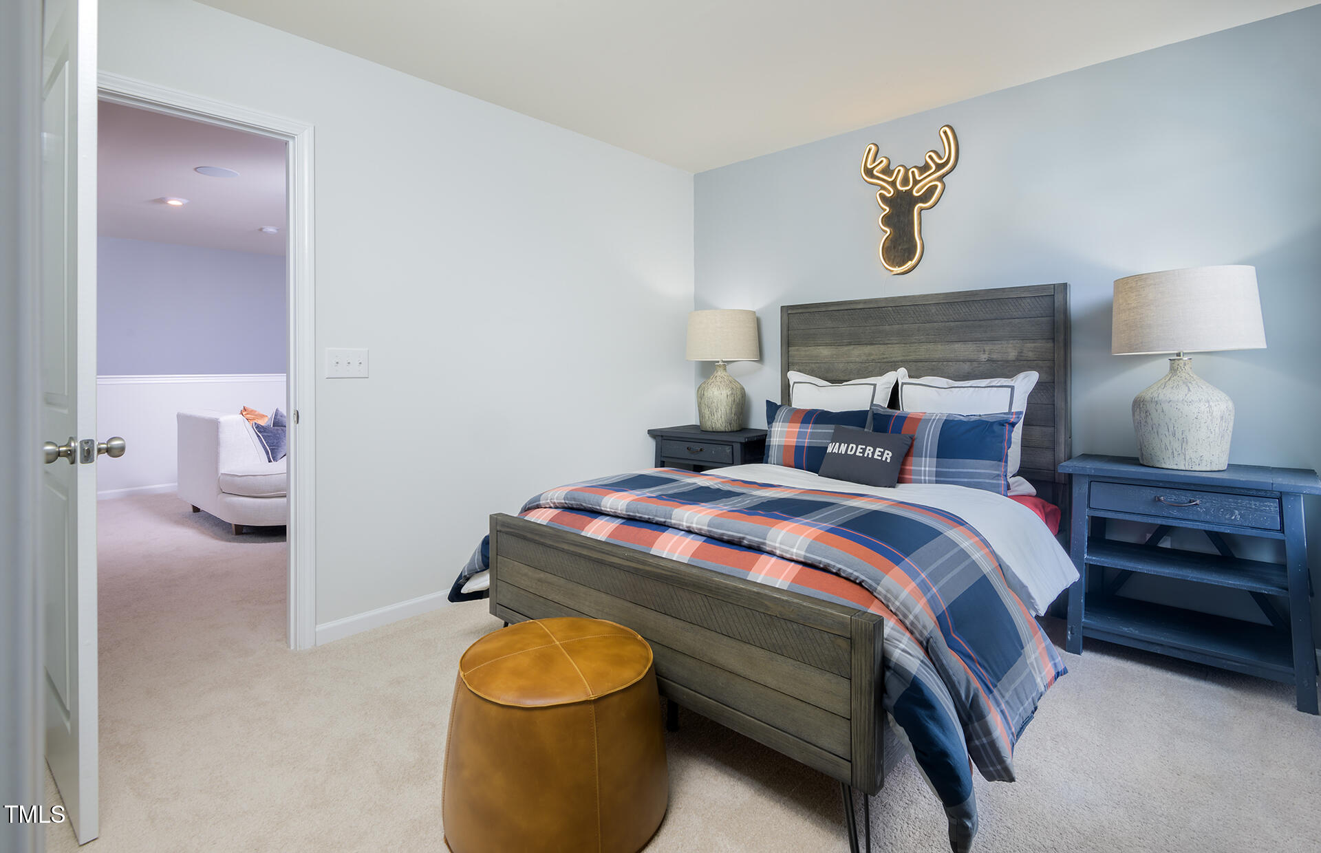 1011 Freestone Road Durham, NC 27703 - Photo 17 of 20 a bedroom with a bed and a lamp on table