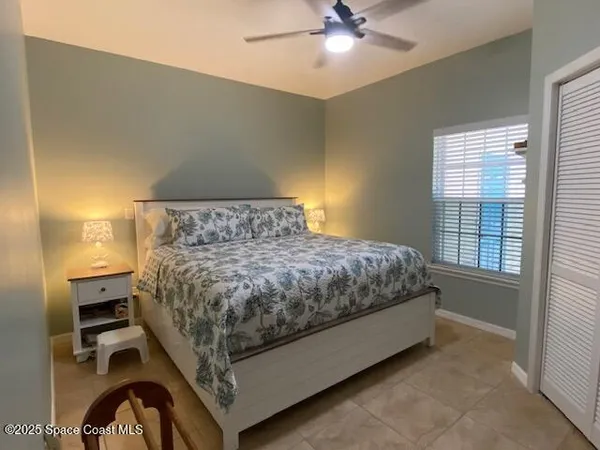 a room with furniture and large windows
