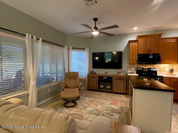a kitchen with stainless steel appliances a stove and a microwave