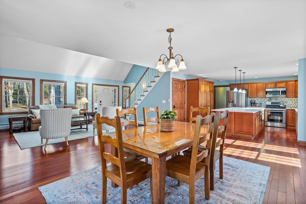 277 Sawyer Road Bolton, MA 01740 - Photo 11 of 41 a view of a dining room with furniture and wooden floor