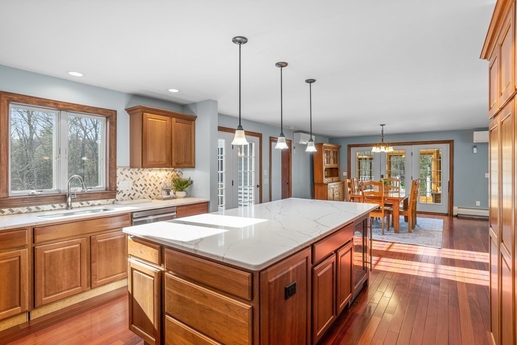277 Sawyer Road Bolton, MA 01740 - Photo 12 of 41 a kitchen with a stove and countertop cabinets