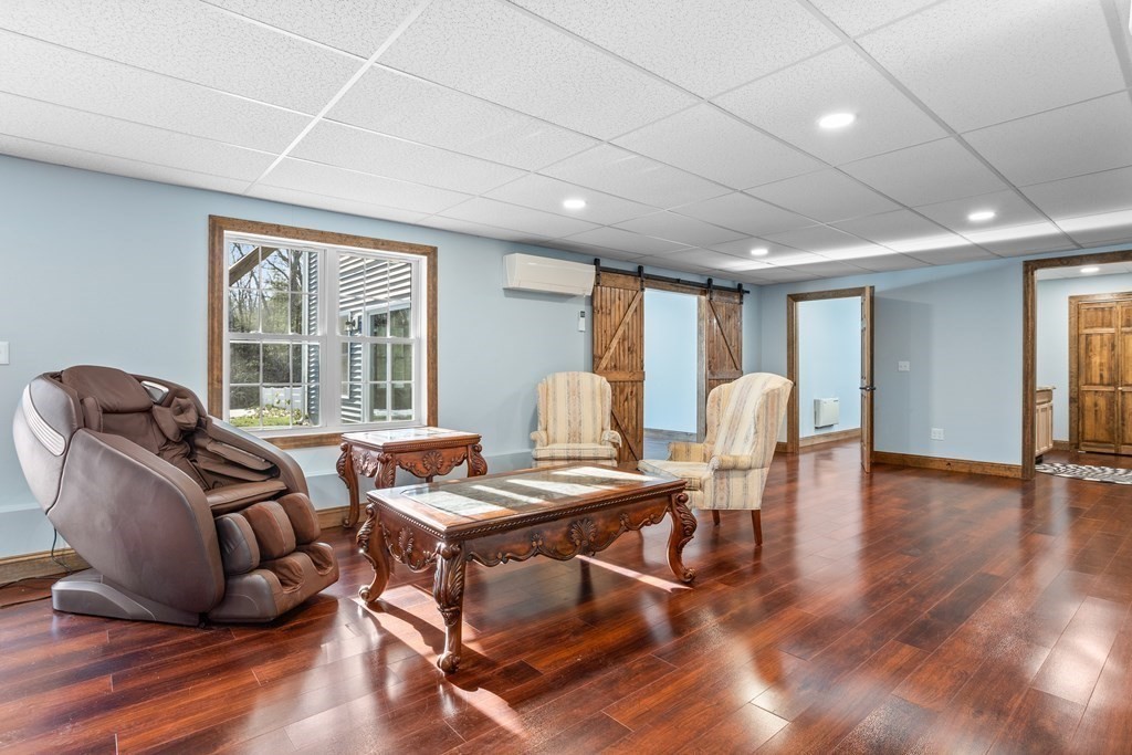 277 Sawyer Road Bolton, MA 01740 - Photo 30 of 41 a workspace with furniture window and wooden floor