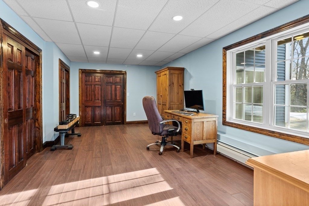 277 Sawyer Road Bolton, MA 01740 - Photo 35 of 41 a view of a workspace with furniture and a window