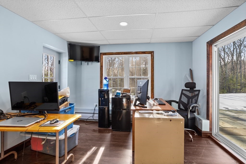 277 Sawyer Road Bolton, MA 01740 - Photo 36 of 41 a room with furniture and a flat screen tv