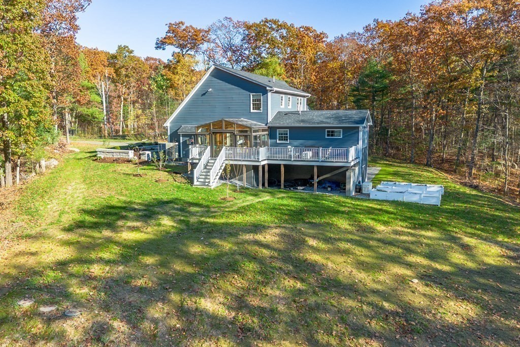 277 Sawyer Road Bolton, MA 01740 - Photo 38 of 41 a view of a house with a big yard