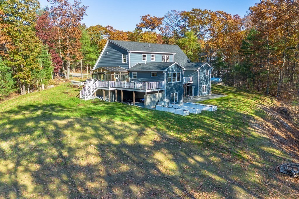 277 Sawyer Road Bolton, MA 01740 - Photo 41 of 41 a view of a house with a big yard and large trees