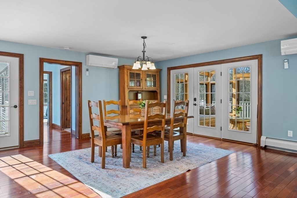 277 Sawyer Road Bolton, MA 01740 - Photo 10 of 41 a view of a dining room with furniture window and wooden floor
