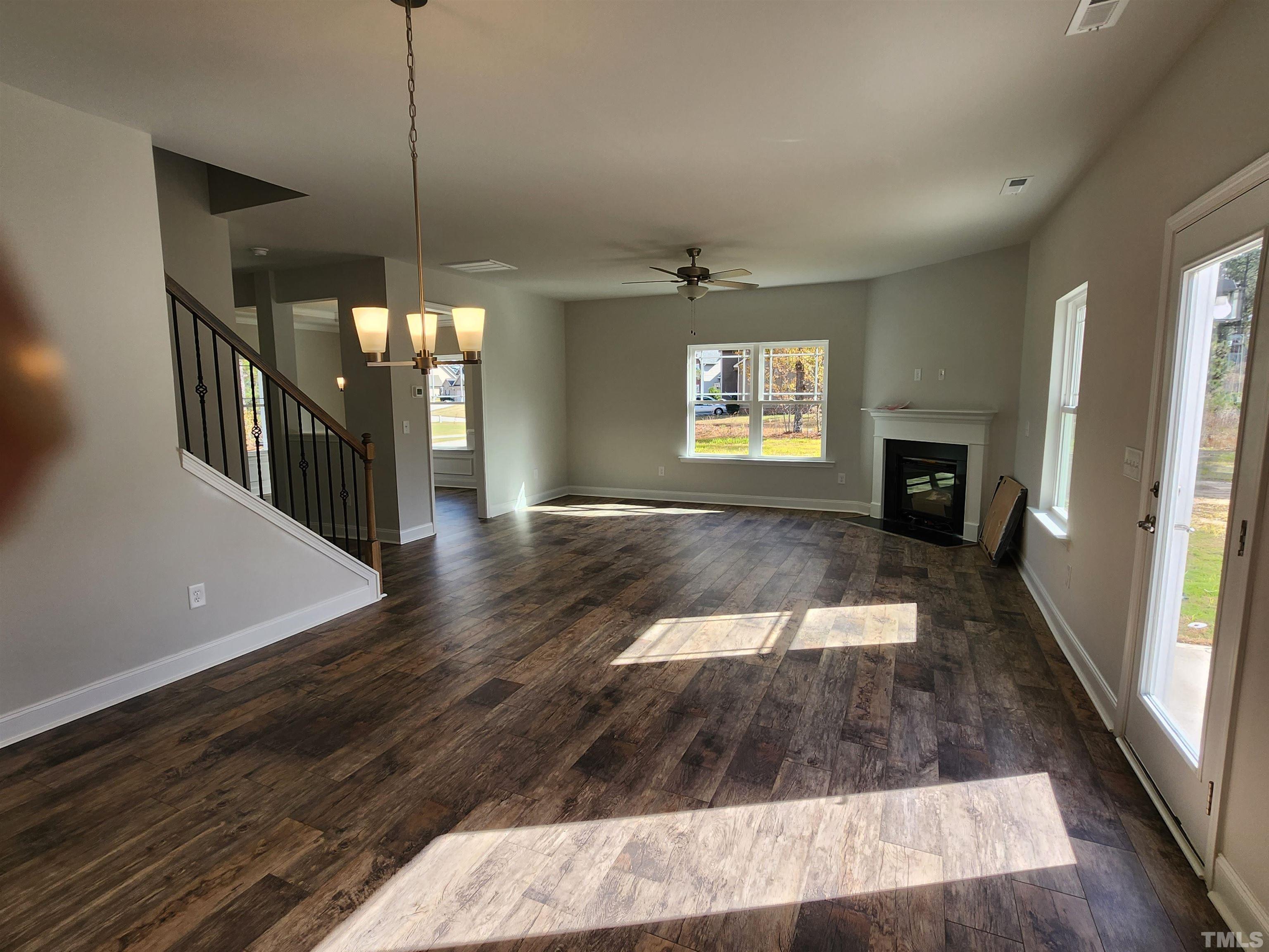 243 Spring Flowers Drive Cameron, NC 28326 - Photo 11 of 30 a view of a living room a fireplace