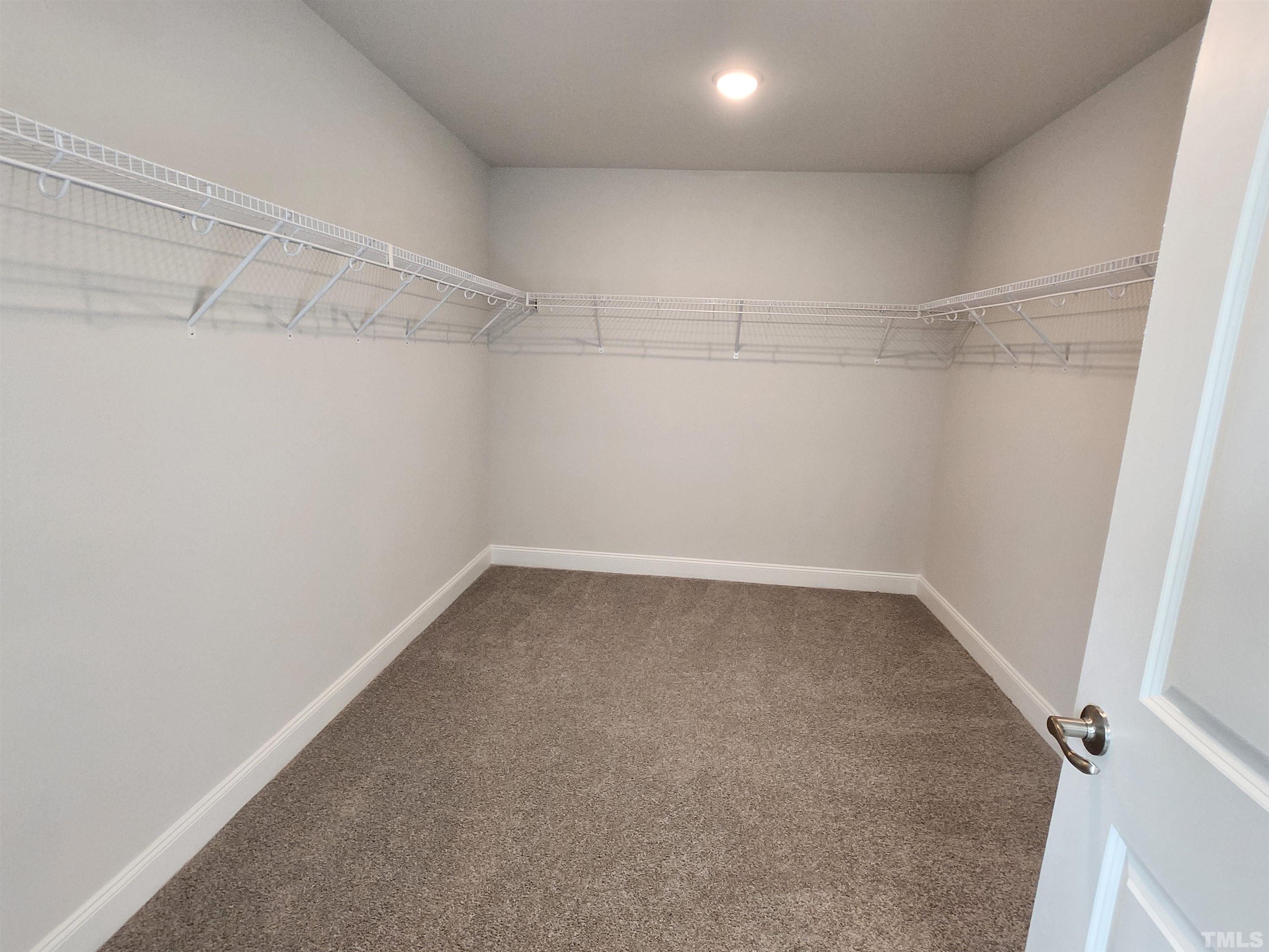 243 Spring Flowers Drive Cameron, NC 28326 - Photo 16 of 30 a view of a room with racks on the wall