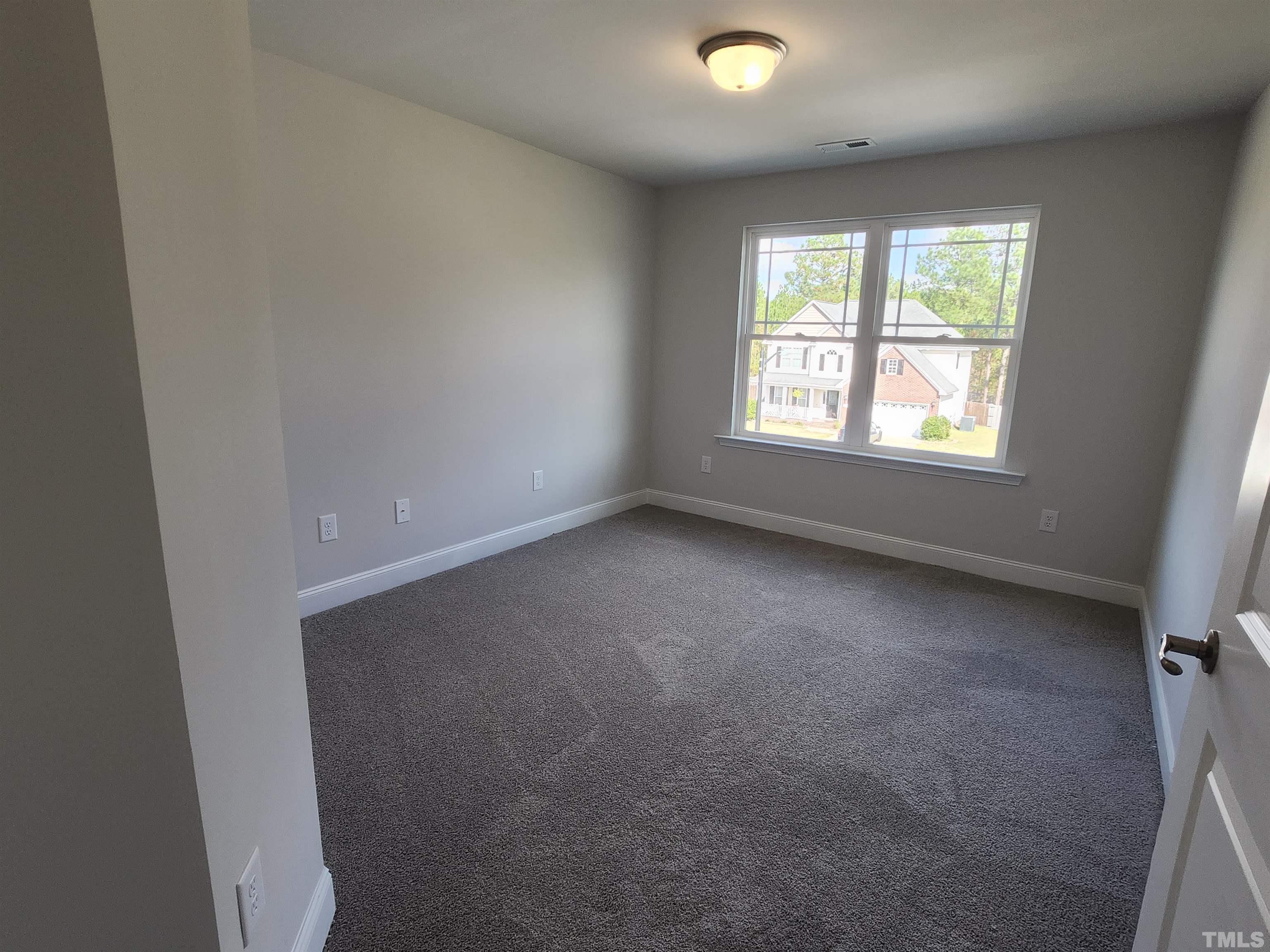 243 Spring Flowers Drive Cameron, NC 28326 - Photo 17 of 30 an empty room with a window