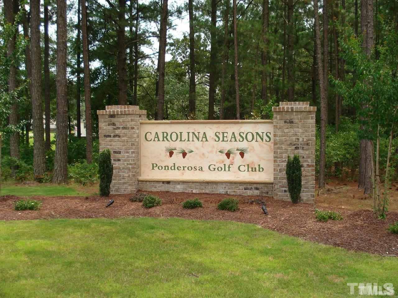 243 Spring Flowers Drive Cameron, NC 28326 - Photo 2 of 30 a sign on the side of the road