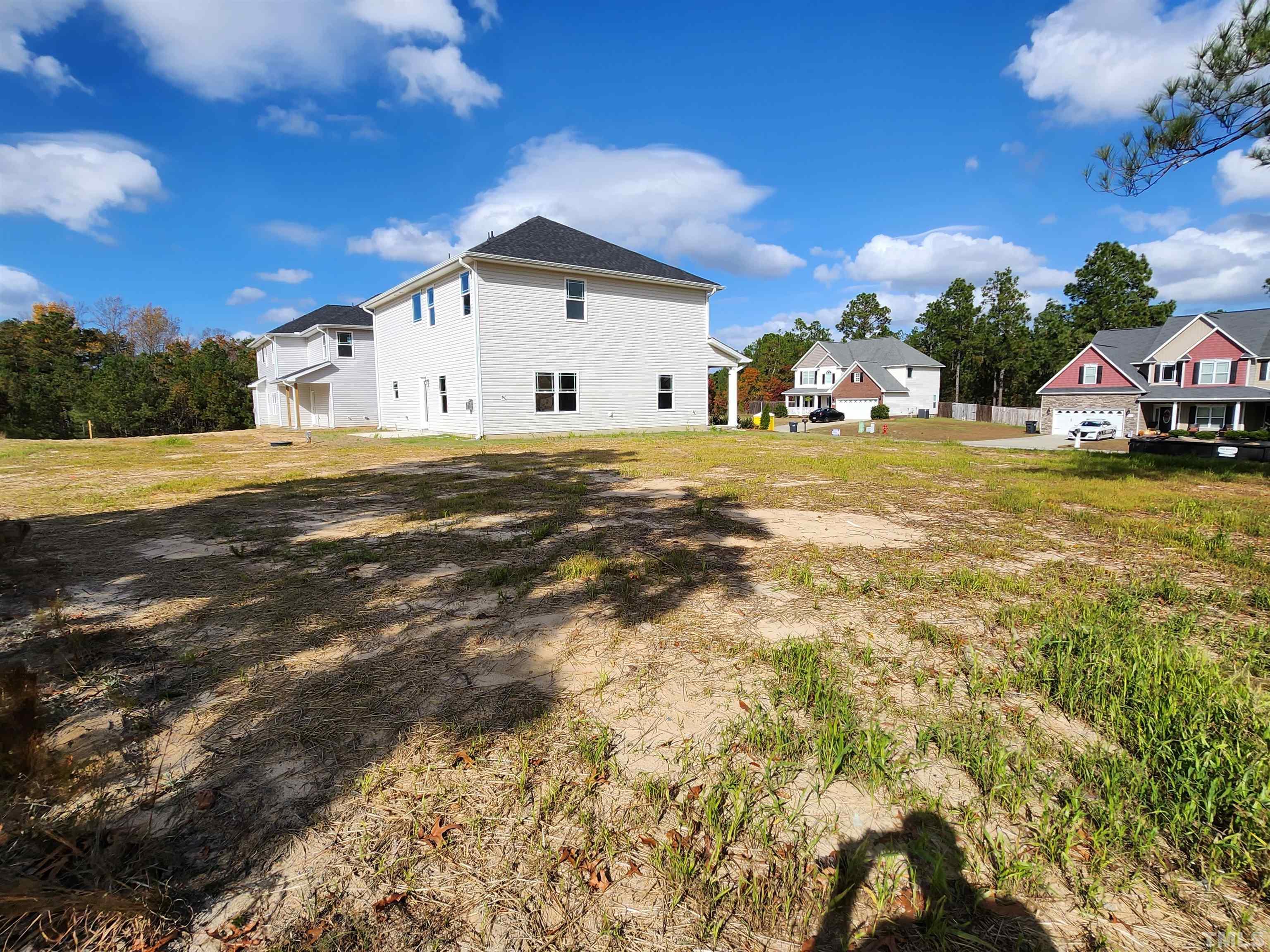 243 Spring Flowers Drive Cameron, NC 28326 - Photo 23 of 30 a view of a house with a yard