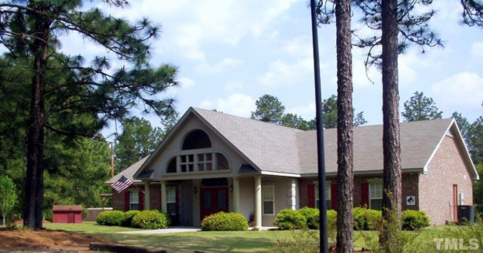 243 Spring Flowers Drive Cameron, NC 28326 - Photo 27 of 30 a front view of a house with garden