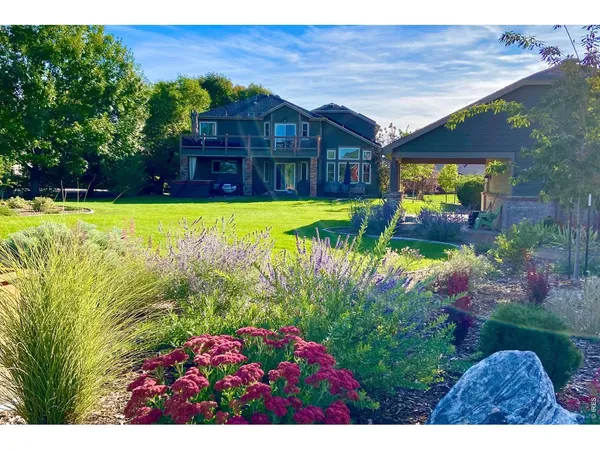 a view of a house with a yard porch and sitting area