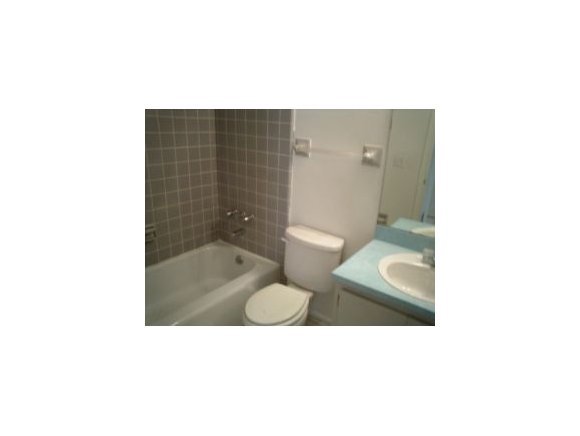 3291 Northeast Fairfax Palm Bay, FL 32905 - Photo 9 of 12 a bathroom with a toilet and a shower