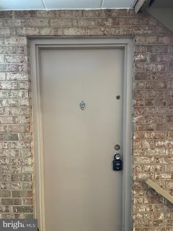 a view of an empty room with a fireplace