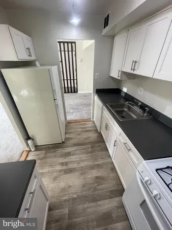 view of a hallway with wooden door
