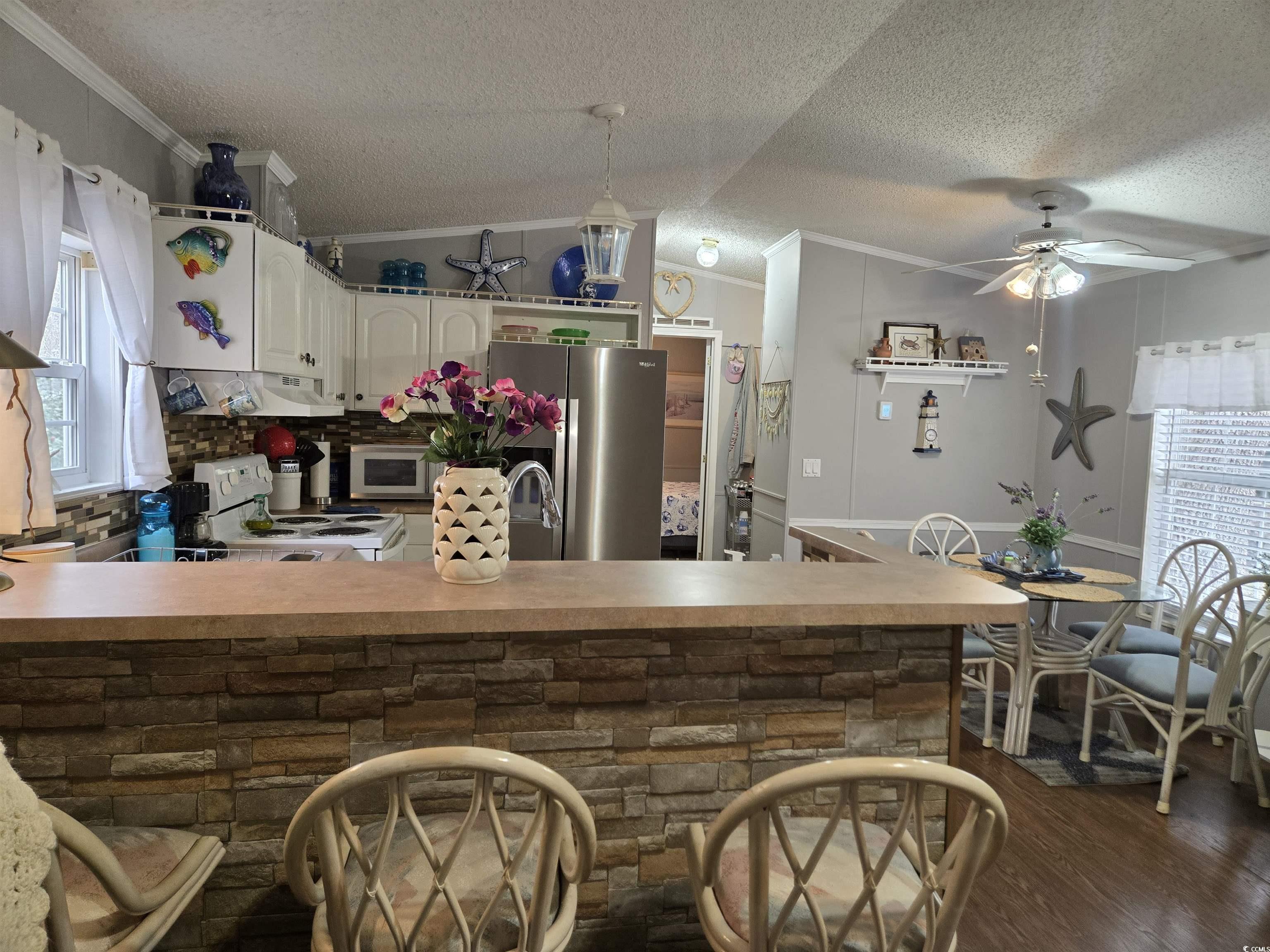 512 Porter Drive Murrells Inlet, SC 29576 - Photo 11 of 31 Kitchen featuring ornamental molding, under cabine