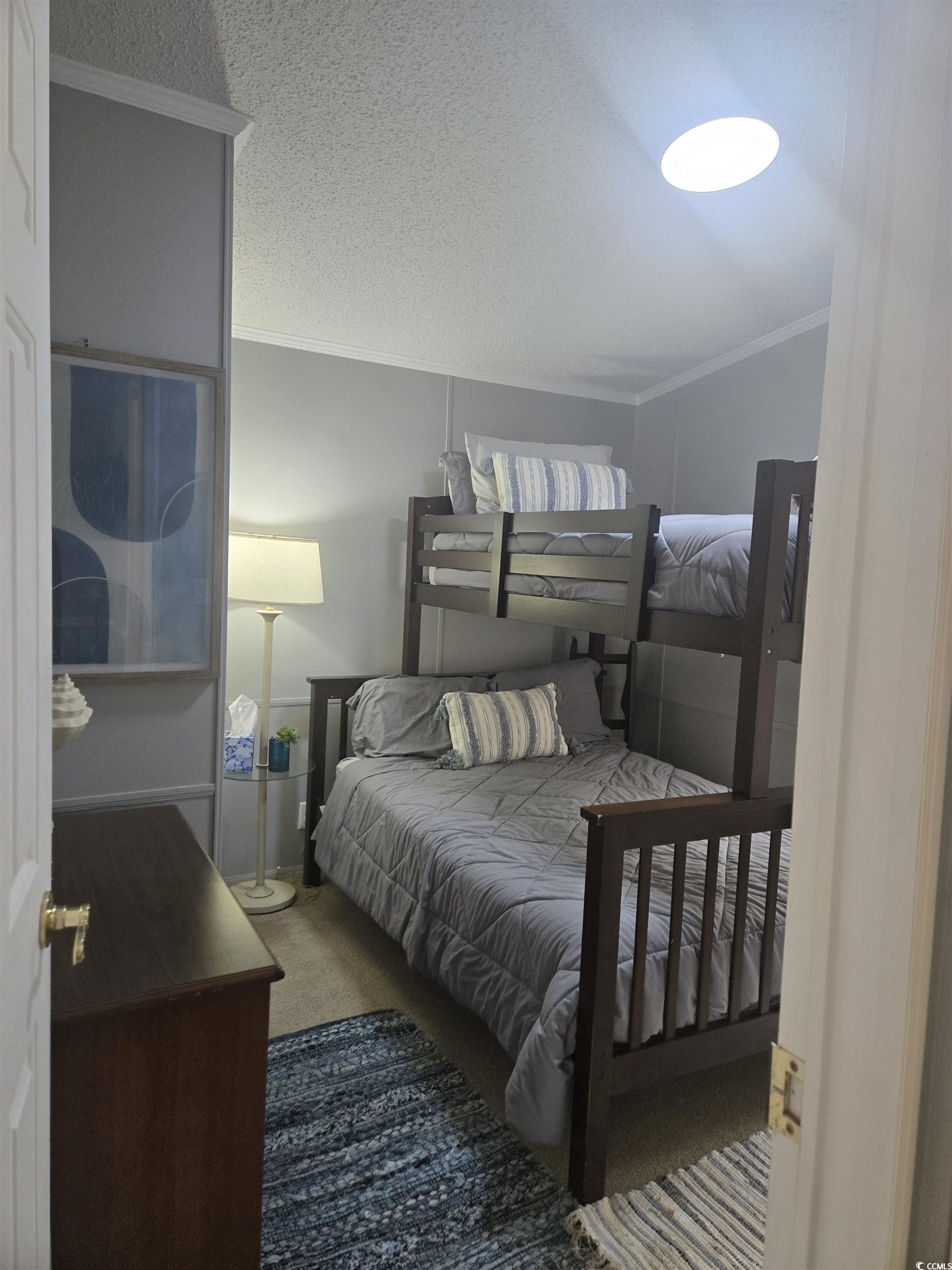 512 Porter Drive Murrells Inlet, SC 29576 - Photo 15 of 31 Bedroom featuring ornamental molding, a textured c