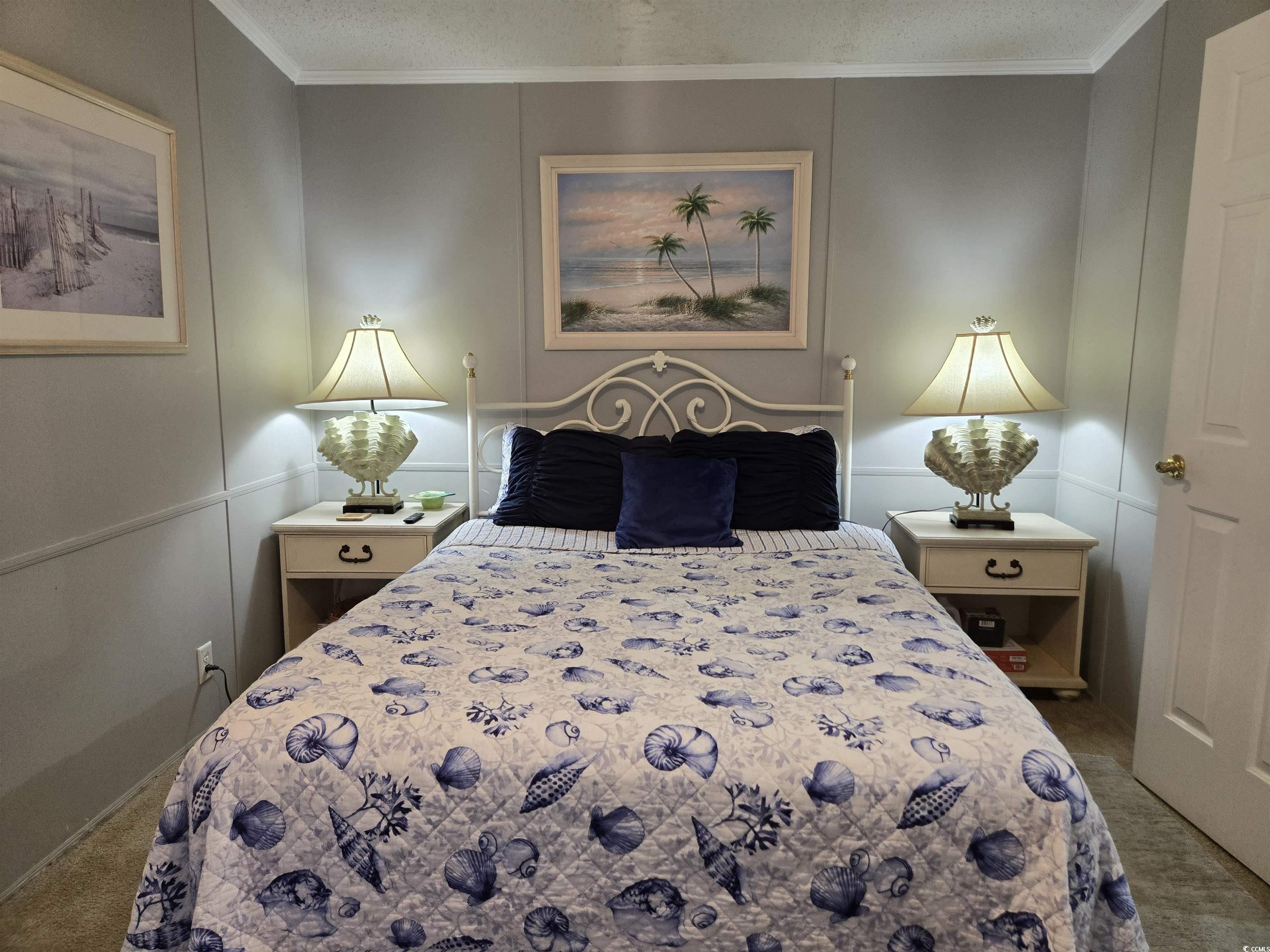 512 Porter Drive Murrells Inlet, SC 29576 - Photo 16 of 31 Bedroom featuring a textured ceiling, carpet, orna