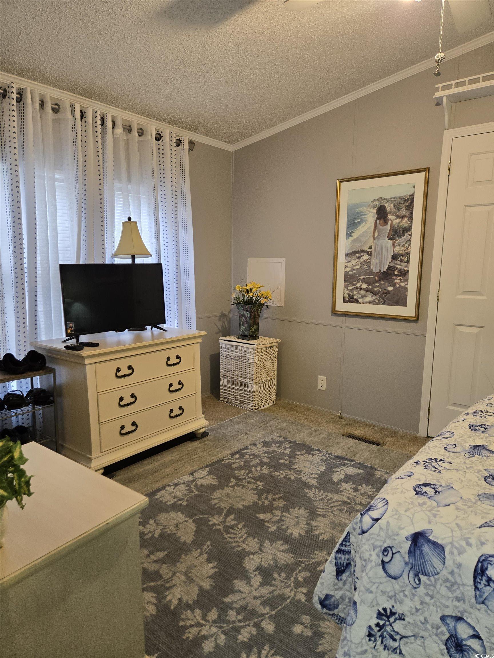 512 Porter Drive Murrells Inlet, SC 29576 - Photo 17 of 31 Carpeted bedroom with a textured ceiling, crown mo