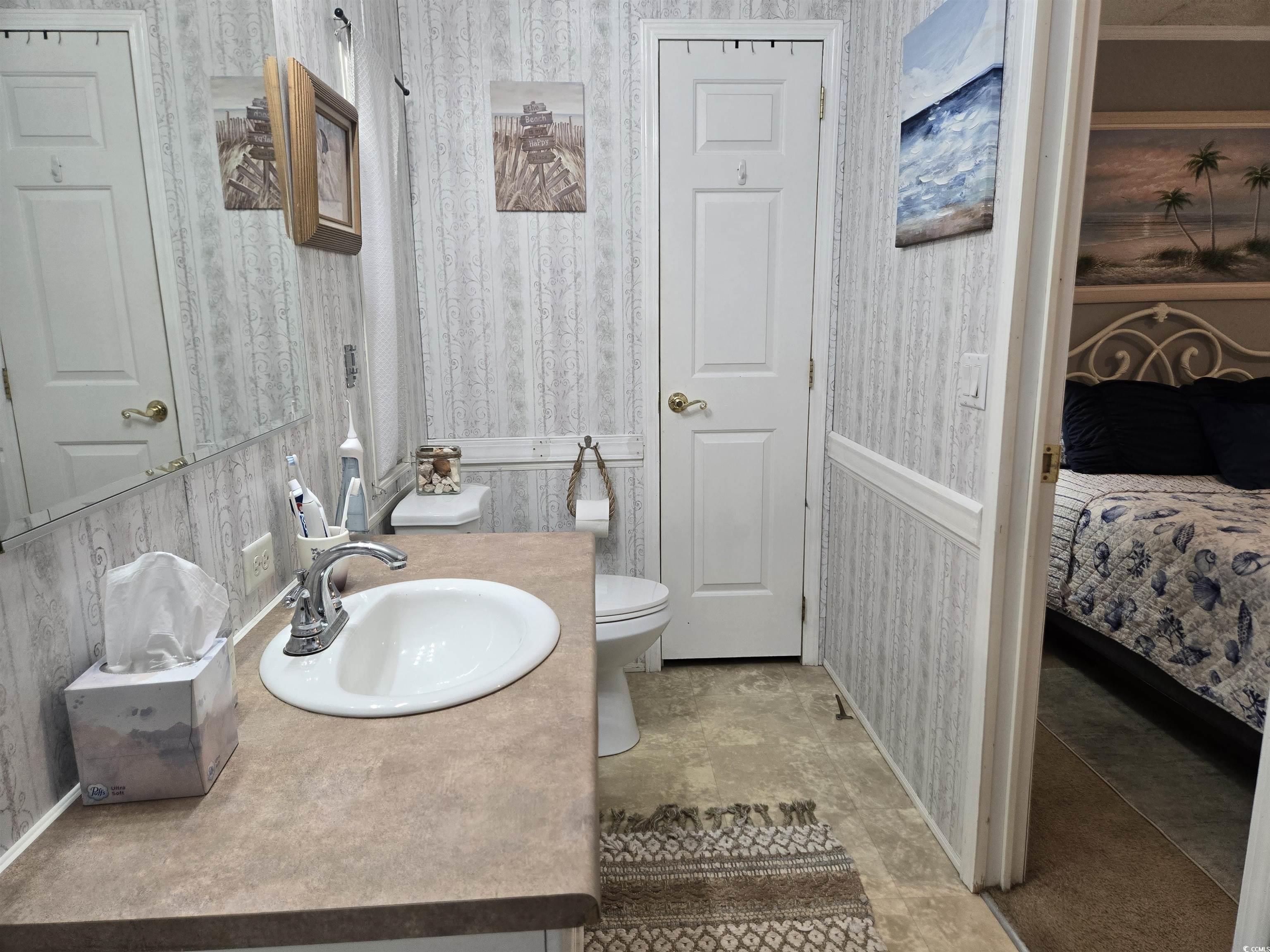 512 Porter Drive Murrells Inlet, SC 29576 - Photo 20 of 31 Bathroom with ensuite bathroom, toilet, vanity, an