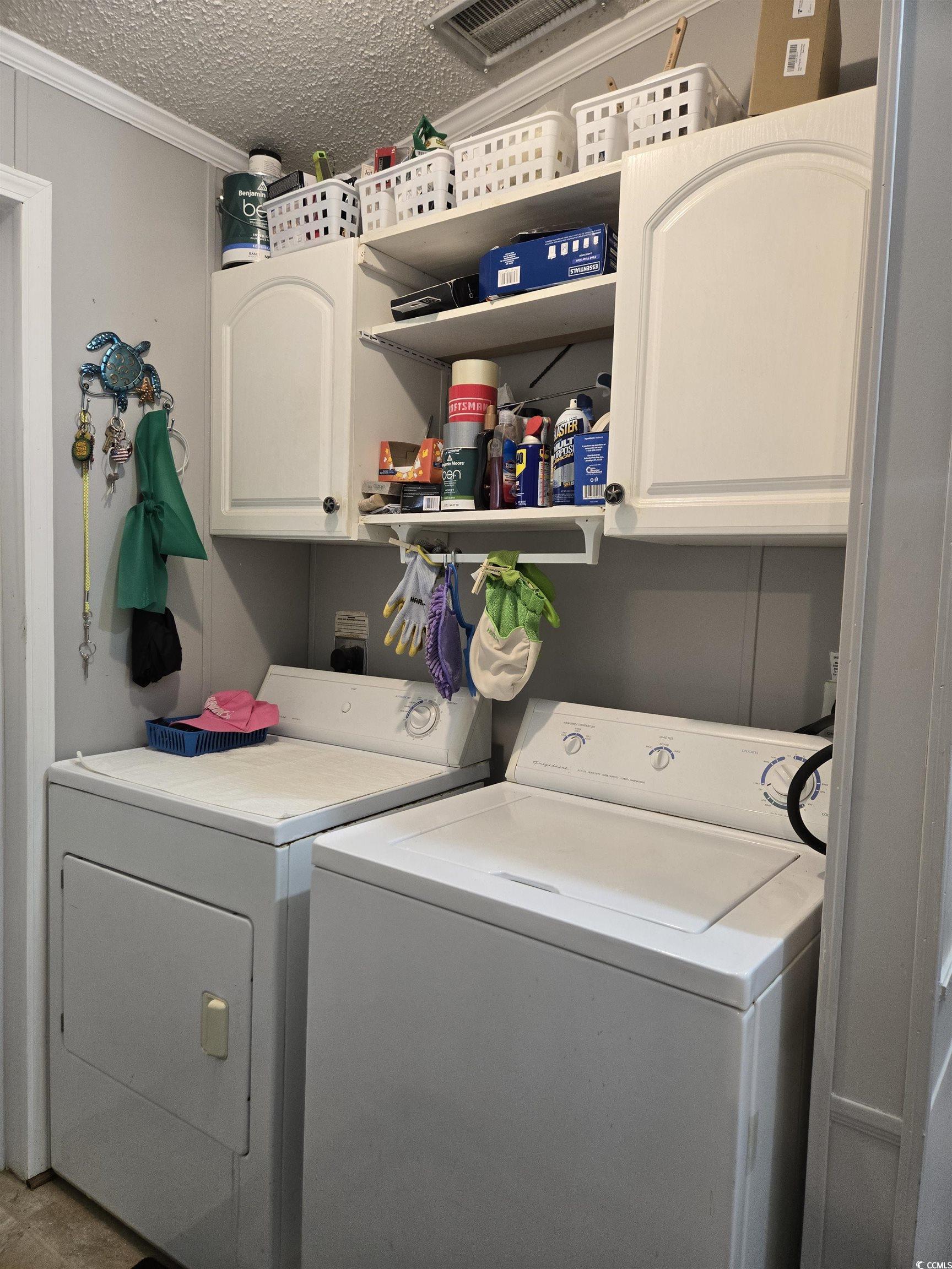 512 Porter Drive Murrells Inlet, SC 29576 - Photo 22 of 31 Laundry area featuring cabinet space, separate was